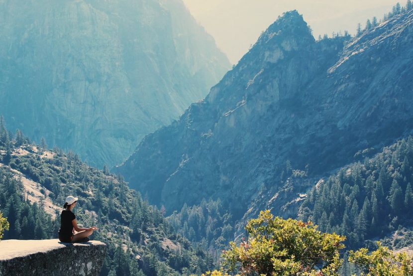 Benefits of mindfulness - Meditating on mountain
